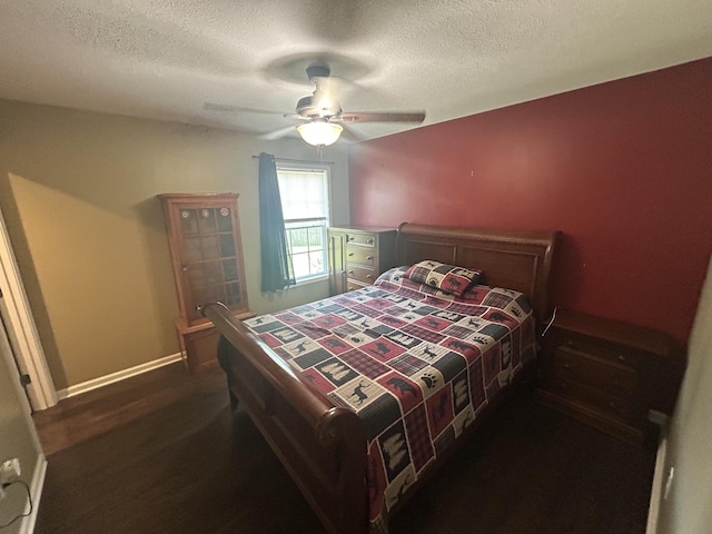 49 Rebecca Ln W, Estill Springs, TN 37330 - bedroom featuring a textured ceiling, a ceiling fan, and dark wood finished floors