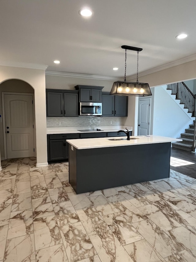 1775 Oak Forest Dr, Clarksville, TN 37043 - kitchen with stainless steel microwave, ornamental molding, black electric stovetop, light countertops, and recessed lighting