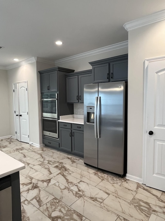 1775 Oak Forest Dr, Clarksville, TN 37043 - kitchen with appliances with stainless steel finishes, light countertops, crown molding, recessed lighting, and light marble finish floors