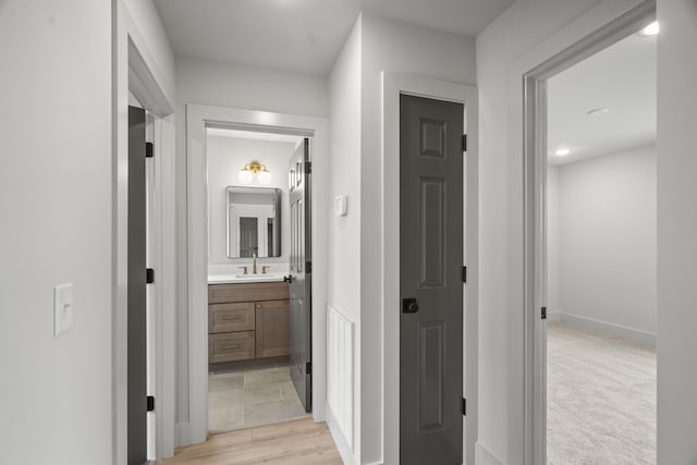 165 Lear Rd, Portland, TN 37148 - hall featuring a sink and light wood-type flooring