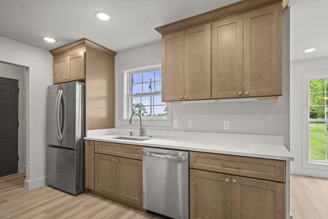 165 Lear Rd, Portland, TN 37148 - kitchen featuring appliances with stainless steel finishes, healthy amount of natural light, light wood finished floors, and recessed lighting