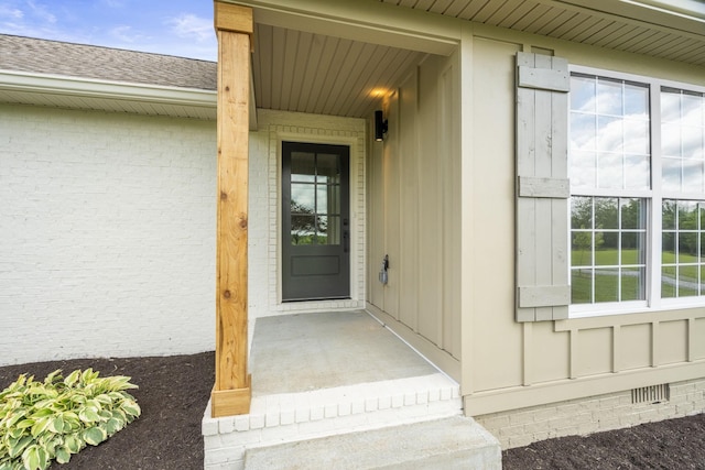165 Lear Rd, Portland, TN 37148 - entrance to property featuring crawl space, roof with shingles, brick siding, and board and batten siding
