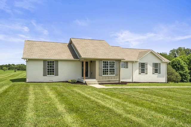 165 Lear Rd, Portland, TN 37148 - view of front of home featuring a front lawn, roof with shingles, and brick siding