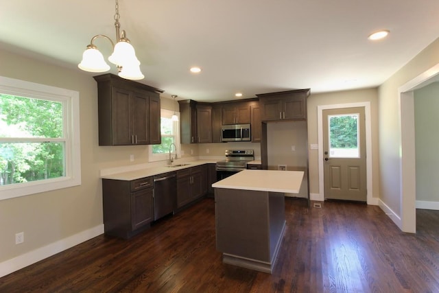 762 Austin Bottom Rd, Baxter, TN 38544 - kitchen with stainless steel appliances, light countertops, a chandelier, dark brown cabinetry, and recessed lighting