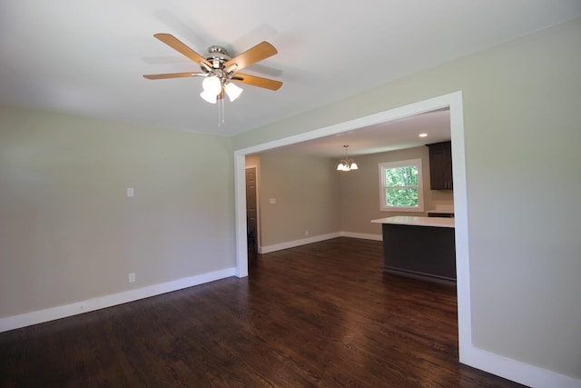 762 Austin Bottom Rd, Baxter, TN 38544 - unfurnished living room with dark wood-style flooring, a chandelier, and ceiling fan