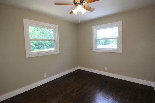 762 Austin Bottom Rd, Baxter, TN 38544 - unfurnished room with dark wood finished floors and ceiling fan