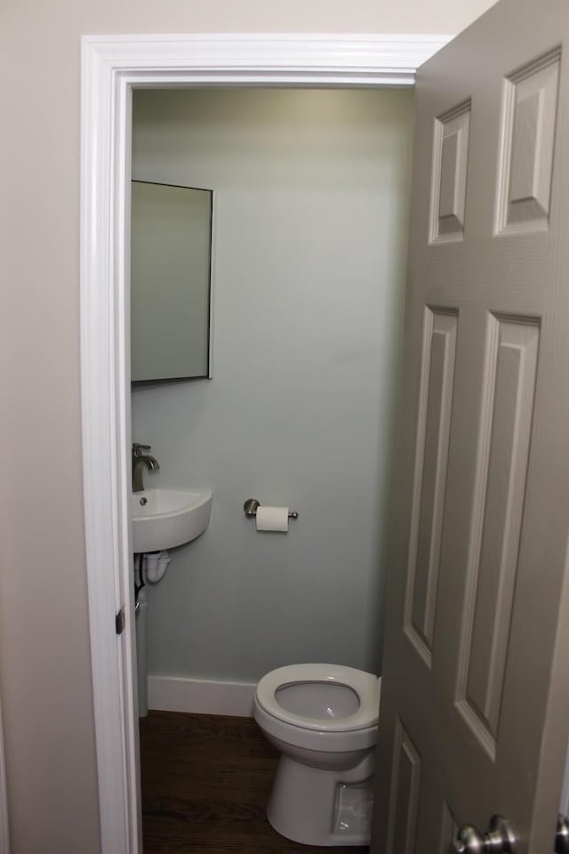 762 Austin Bottom Rd, Baxter, TN 38544 - half bathroom with baseboards and wood finished floors