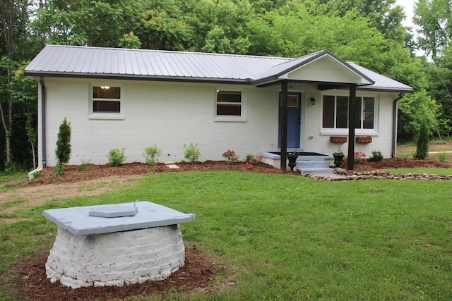 762 Austin Bottom Rd, Baxter, TN 38544 - single story home with a front yard, brick siding, and a metal roof