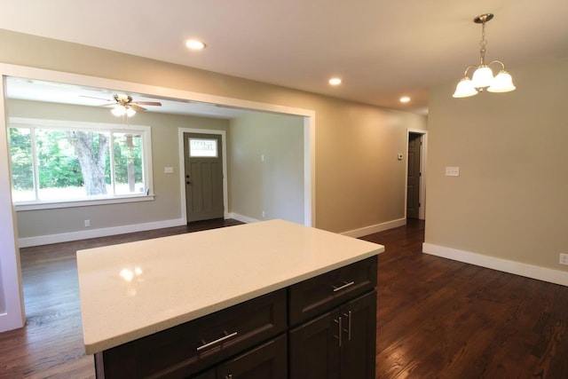 762 Austin Bottom Rd, Baxter, TN 38544 - kitchen featuring light countertops, decorative light fixtures, dark wood-style flooring, recessed lighting, and a center island
