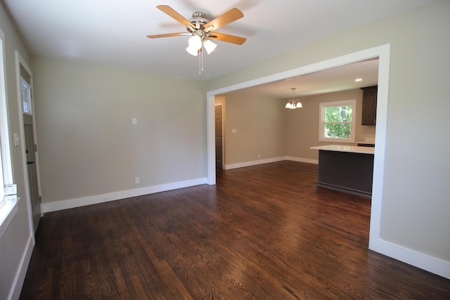 762 Austin Bottom Rd, Baxter, TN 38544 - empty room with a chandelier, ceiling fan, and dark wood-type flooring