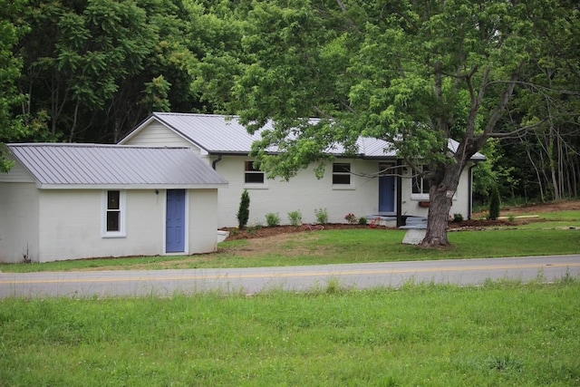 762 Austin Bottom Rd, Baxter, TN 38544 - ranch-style house featuring a front yard and a metal roof