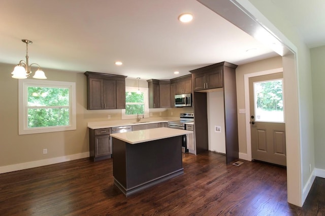762 Austin Bottom Rd, Baxter, TN 38544 - kitchen featuring stainless steel appliances, healthy amount of natural light, light countertops, dark brown cabinetry, and recessed lighting