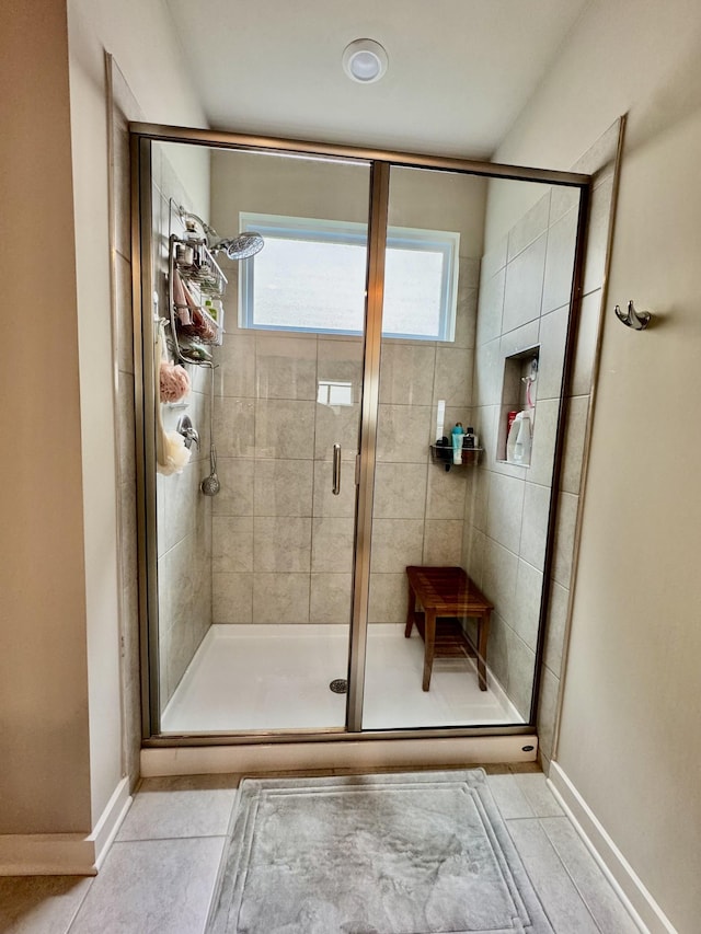 1229 Inverness Pass, Lebanon, TN 37087 - full bath with plenty of natural light, a shower stall, and tile patterned floors