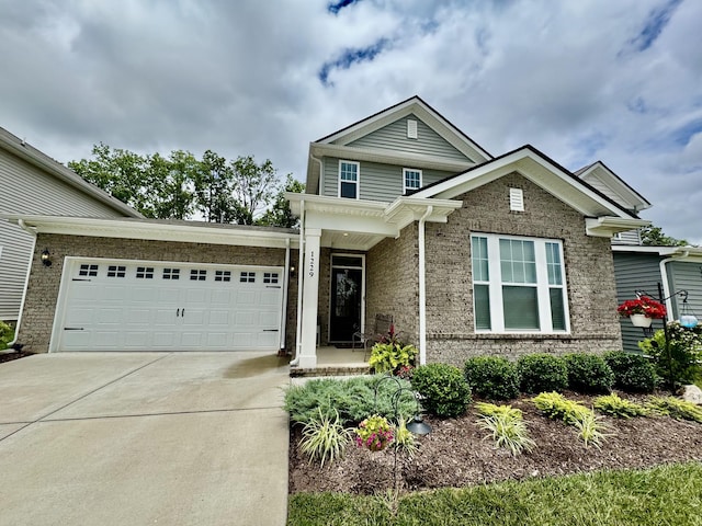 1229 Inverness Pass, Lebanon, TN 37087 - view of front of house featuring concrete driveway, brick siding, and an attached garage