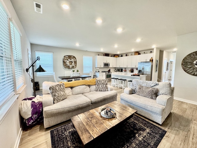 1229 Inverness Pass, Lebanon, TN 37087 - living area with light wood-style flooring and recessed lighting