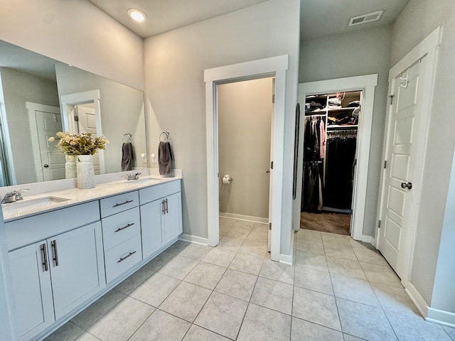 1229 Inverness Pass, Lebanon, TN 37087 - bathroom with double vanity, tile patterned flooring, a spacious closet, and recessed lighting