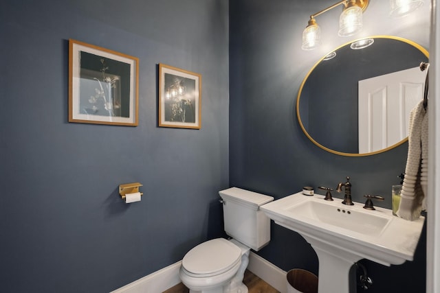 8217 W Chase Ct, Nashville, TN 37221 - half bathroom with toilet and wood finished floors