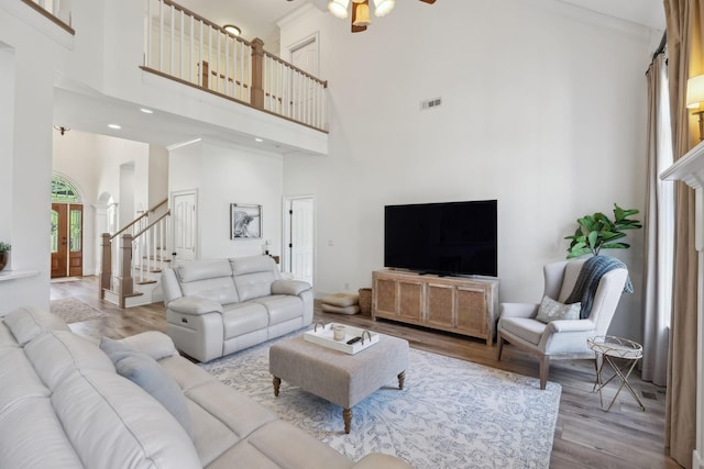 8217 W Chase Ct, Nashville, TN 37221 - living area featuring a towering ceiling, ceiling fan, wood finished floors, and stairs
