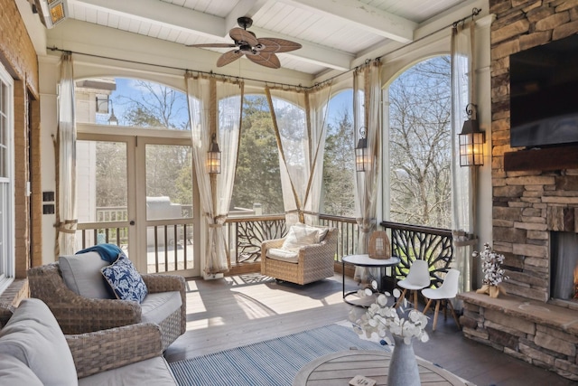 8217 W Chase Ct, Nashville, TN 37221 - sunroom / solarium with ceiling fan, beamed ceiling, and an outdoor stone fireplace
