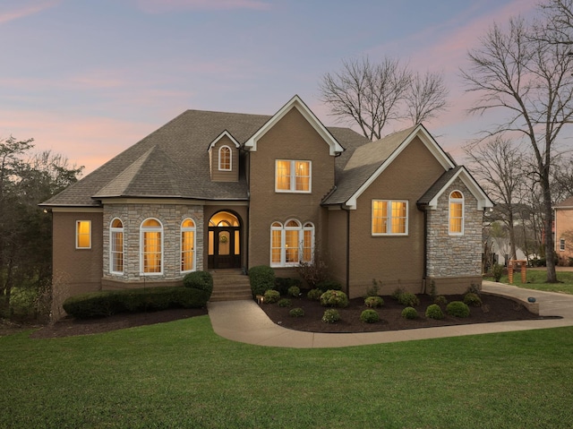 8217 W Chase Ct, Nashville, TN 37221 - view of front of home with stone siding and a front lawn