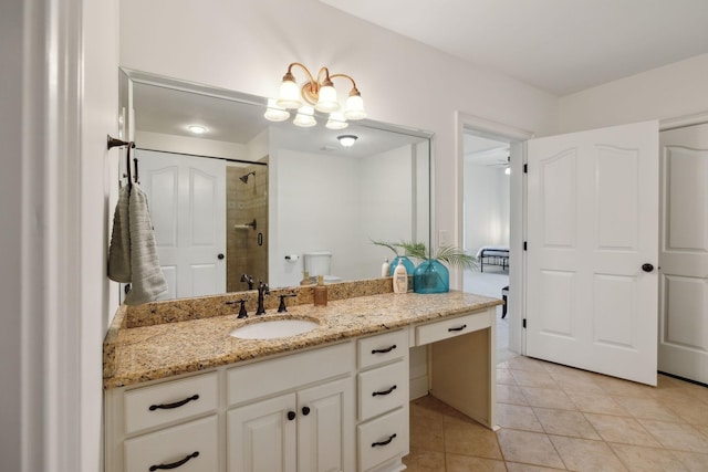8217 W Chase Ct, Nashville, TN 37221 - bathroom featuring vanity, tiled shower, tile patterned flooring, and a chandelier