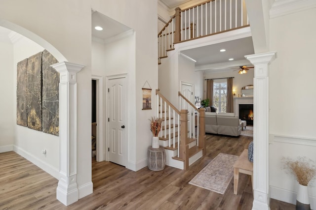 8217 W Chase Ct, Nashville, TN 37221 - foyer entrance featuring ceiling fan, stairs, a high ceiling, wood finished floors, and crown molding