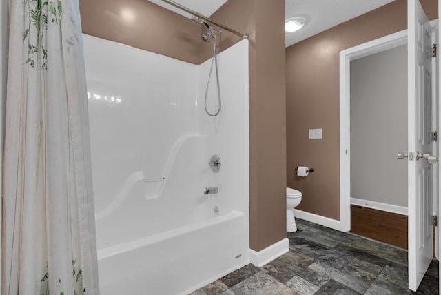 939 Wing Tip Cir, Hopkinsville, KY 42240 - bathroom with shower / bathtub combination with curtain and stone finish flooring