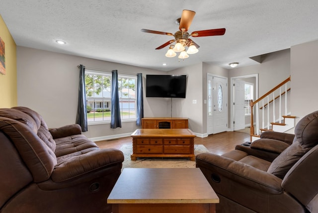 939 Wing Tip Cir, Hopkinsville, KY 42240 - living room with a textured ceiling, ceiling fan, recessed lighting, stairway, and light wood finished floors