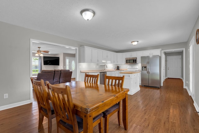 939 Wing Tip Cir, Hopkinsville, KY 42240 - dining space with wood finished floors, ceiling fan, and a textured ceiling