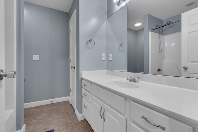 939 Wing Tip Cir, Hopkinsville, KY 42240 - bathroom with vanity, a shower, and tile patterned floors
