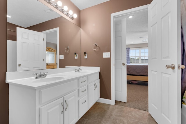 939 Wing Tip Cir, Hopkinsville, KY 42240 - ensuite bathroom featuring double vanity and tile patterned floors