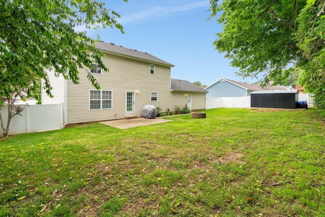 939 Wing Tip Cir, Hopkinsville, KY 42240 - back of property with a patio area and a fenced backyard