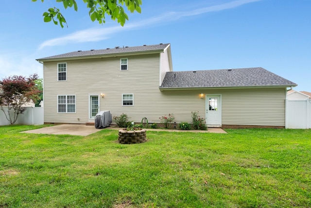 939 Wing Tip Cir, Hopkinsville, KY 42240 - back of house with a patio area, roof with shingles, and a fire pit