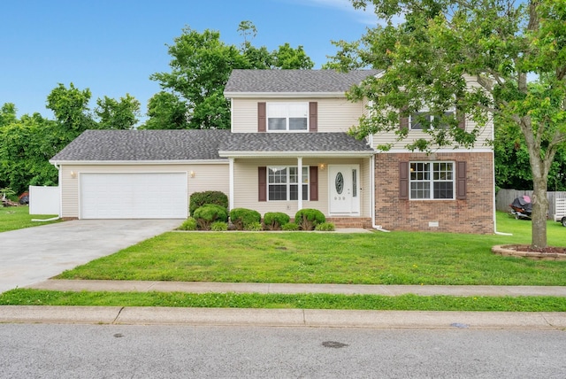 939 Wing Tip Cir, Hopkinsville, KY 42240 - traditional home featuring an attached garage, concrete driveway, a front lawn, and brick siding