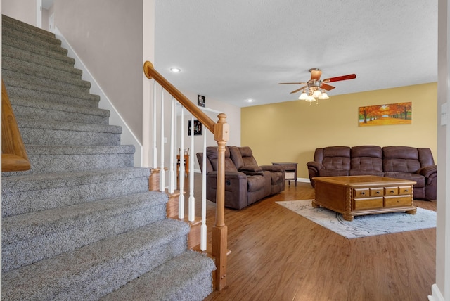 939 Wing Tip Cir, Hopkinsville, KY 42240 - living area with stairs, wood finished floors, a ceiling fan, and recessed lighting