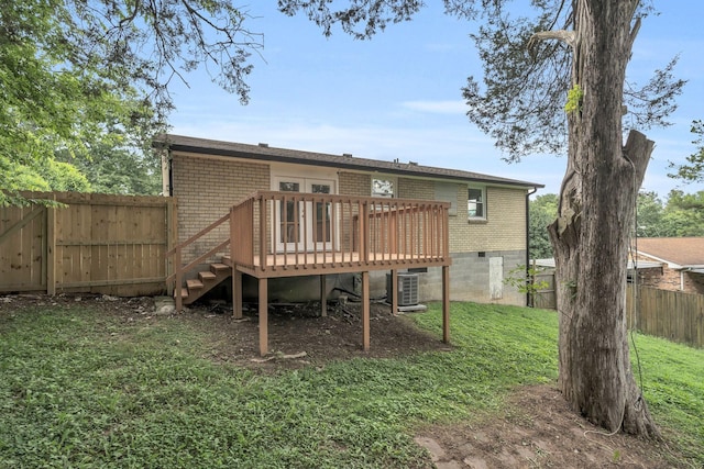 4921 Shihmen Dr, Antioch, TN 37013 - rear view of property featuring brick siding, a wooden deck, a fenced backyard, and crawl space