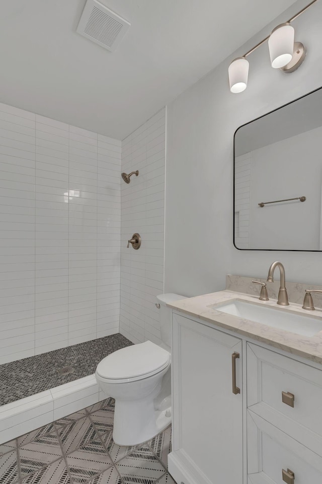 4921 Shihmen Dr, Antioch, TN 37013 - full bath with vanity, tiled shower, and tile patterned flooring