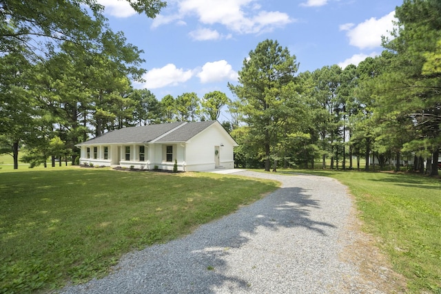 5670 Lakeview Rd, Springfield, TN 37172 - view of front of property with driveway, a front lawn, and view of wooded area