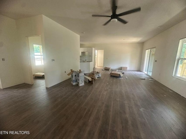 250 Old Grimsley Ct, Grimsley, TN 38565 - unfurnished living room featuring dark wood-style floors, healthy amount of natural light, and a ceiling fan