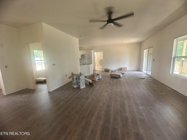 250 Old Grimsley Ct, Grimsley, TN 38565 - unfurnished living room with dark wood-style flooring, a ceiling fan, and plenty of natural light