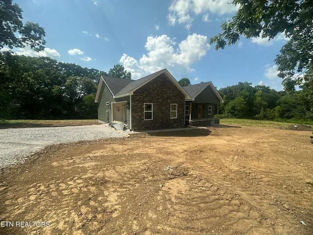 250 Old Grimsley Ct, Grimsley, TN 38565 - view of property exterior with covered porch and stone siding