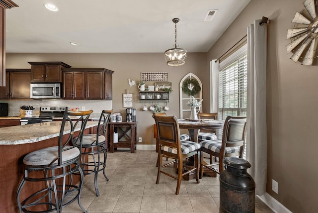 1192 Wicke Rd, Adams, TN 37010 - dining space featuring light tile patterned floors and recessed lighting