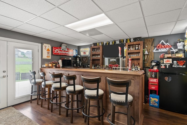 1192 Wicke Rd, Adams, TN 37010 - indoor dry bar featuring wood finished floors and a drop ceiling