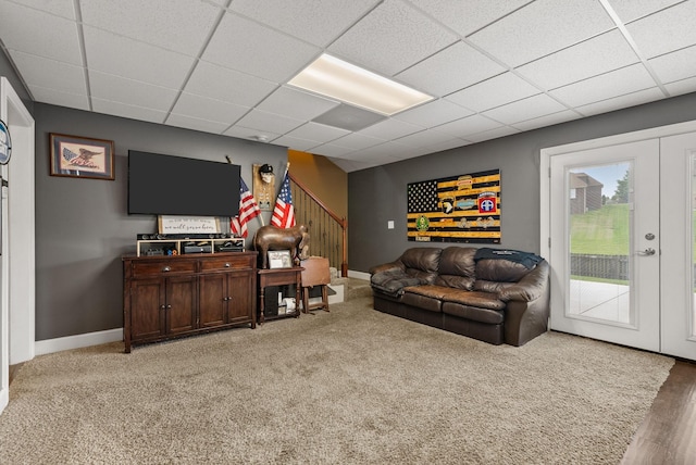 1192 Wicke Rd, Adams, TN 37010 - living room featuring stairway, a paneled ceiling, and carpet