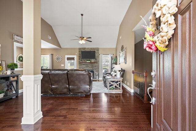 1192 Wicke Rd, Adams, TN 37010 - living area featuring hardwood / wood-style flooring, decorative columns, a ceiling fan, high vaulted ceiling, and a stone fireplace