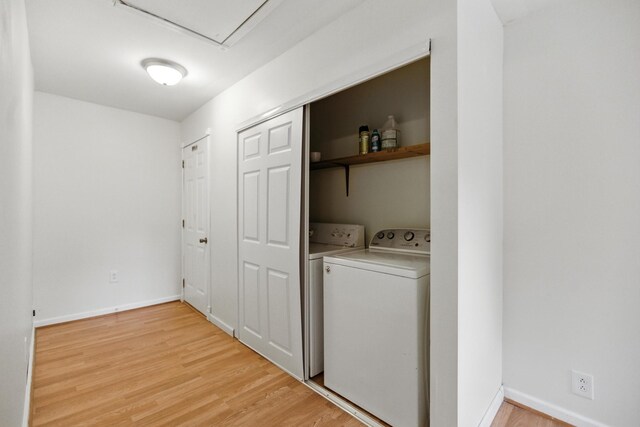 215 Patrick St, Estill Springs, TN 37330 - laundry room with washer and clothes dryer and light wood finished floors
