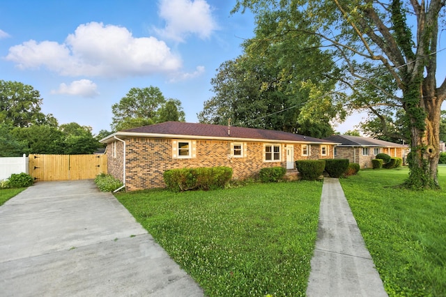 215 Patrick St, Estill Springs, TN 37330 - single story home featuring driveway, a gate, and brick siding