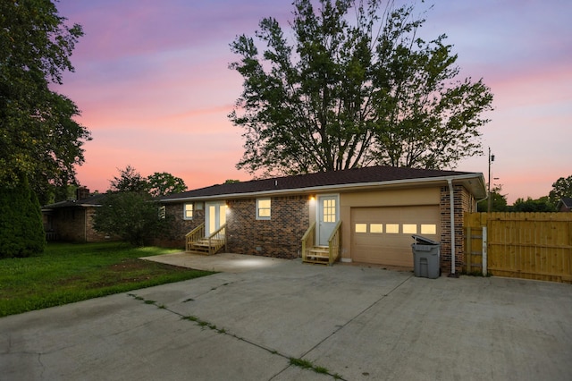 215 Patrick St, Estill Springs, TN 37330 - single story home featuring entry steps, a garage, driveway, and brick siding