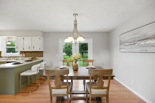215 Patrick St, Estill Springs, TN 37330 - dining area with light wood-type flooring and a textured ceiling