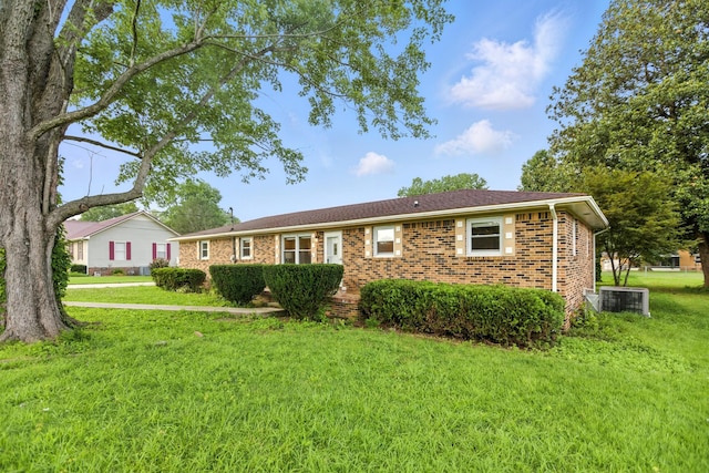 215 Patrick St, Estill Springs, TN 37330 - ranch-style home featuring a front yard and brick siding